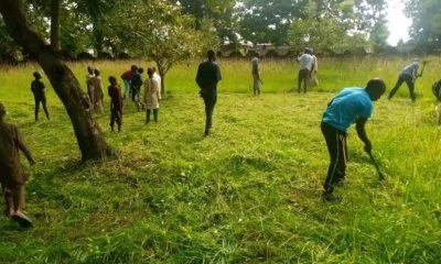 Christians Join Muslims To Clear Grass
